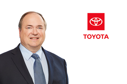 Toyota logo with red square background and white oval emblem above company name