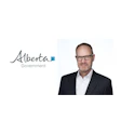Alberta Government logo with professional headshot of male executive in business attire