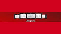 Snap-on brand display featuring five digital tablets arranged horizontally on red background