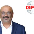 Professional business headshot of a man in navy blazer and white shirt with GFS logo