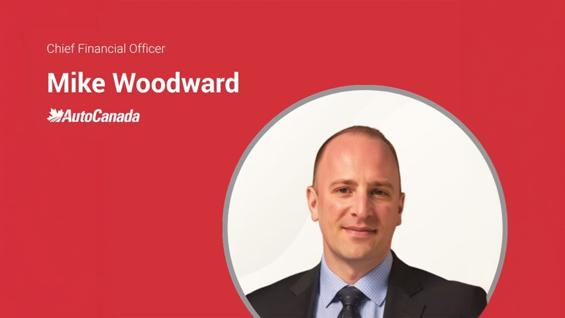 Mike Woodward, Chief Financial Officer at AutoCanada, professional headshot on red background