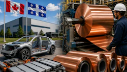 Canadian and Quebec flags at automotive manufacturing facility with copper coils and industrial equipment