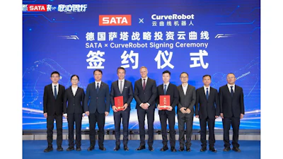 Ten business executives in formal attire holding red documents at SATA and CurveRobot signing ceremony
