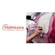 Tropicana Community Services logo with worker polishing pink and white vehicle