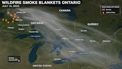 NASA satellite image showing wildfire smoke blankets across Ontario and Quebec on July 14, 2025, with active fire locations marked in orange.