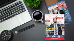 Flat-lay desk setup with laptop, coffee, Collision Repair magazines, clock, and office supplies on gray background