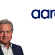 Professional male executive headshot with Aaro company logo featuring navy text and red maple leaf