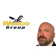 Wesco Group logo featuring black eagle symbol above yellow and black text