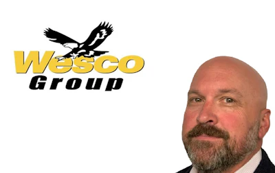 Wesco Group logo featuring black eagle symbol above yellow and black text