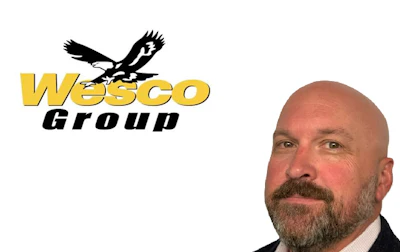 Wesco Group logo featuring black eagle symbol above yellow and black text