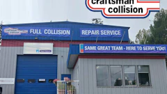 Craftsman Collision auto repair facility with blue metal building, full collision and repair service signage