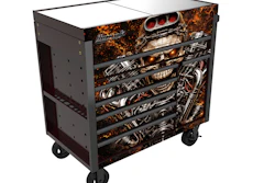 Black mobile tool chest with engine graphics and multiple drawers on wheels