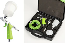Professional airbrush spray gun kit with green hose, paint cups, and accessories in black carrying case