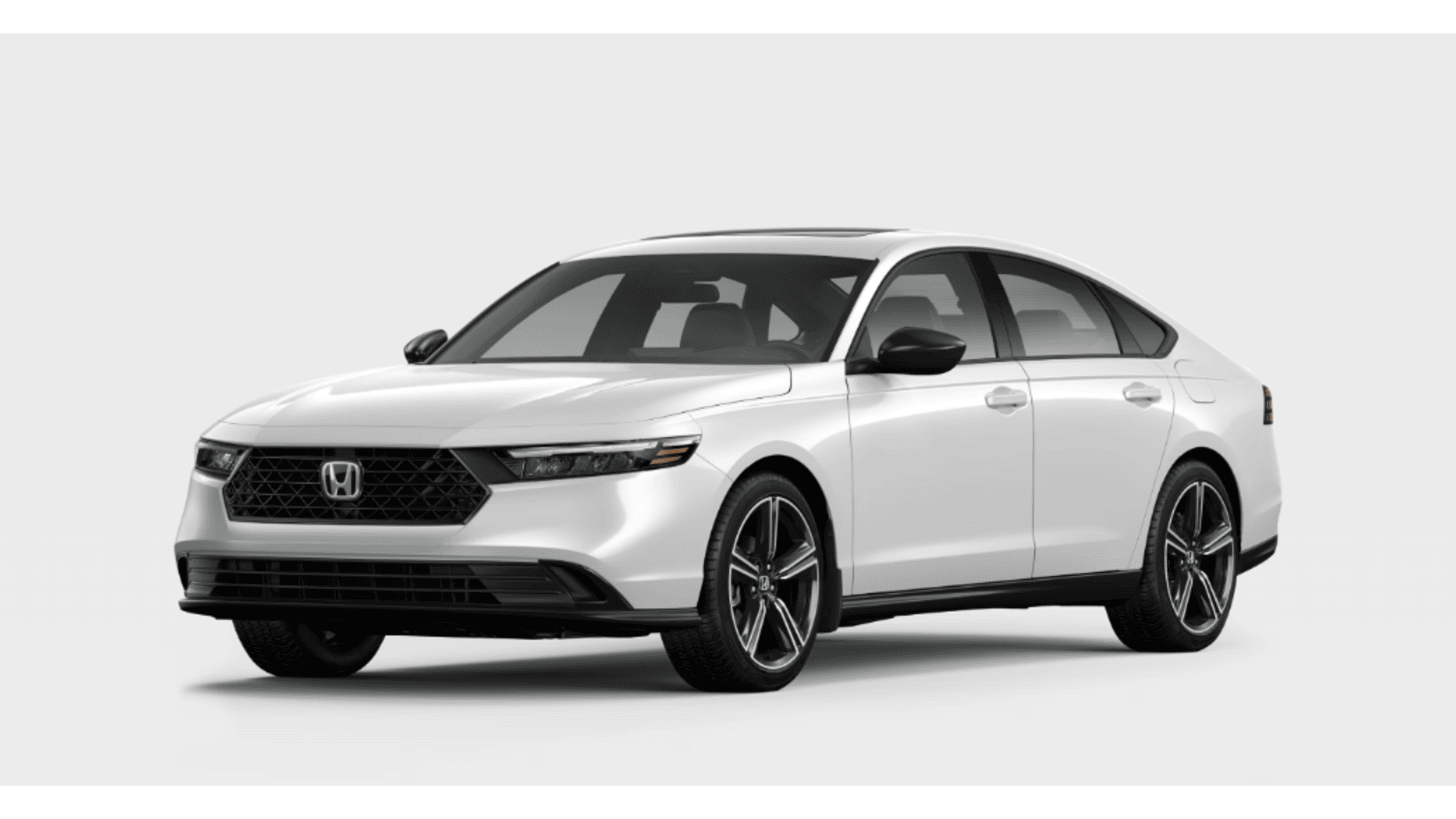 White Honda sedan with modern styling, alloy wheels, and dark grille against neutral background