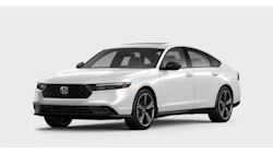 White Honda sedan with modern styling, alloy wheels, and dark grille against neutral background