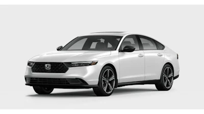 White Honda sedan with modern styling, alloy wheels, and dark grille against neutral background
