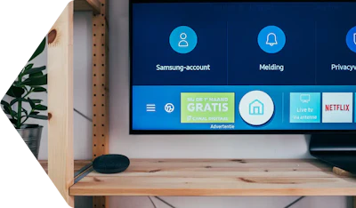 Samsung Smart TV home screen displaying account settings, apps, and services including Netflix and live TV options