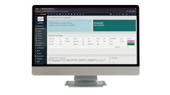 Business analytics dashboard displayed on desktop monitor showing KPI metrics, data tables, and performance charts