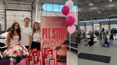 Three staff members stand at a Pit Stop Pilates promotional event in an automotive showroom with pink balloons and flowers.