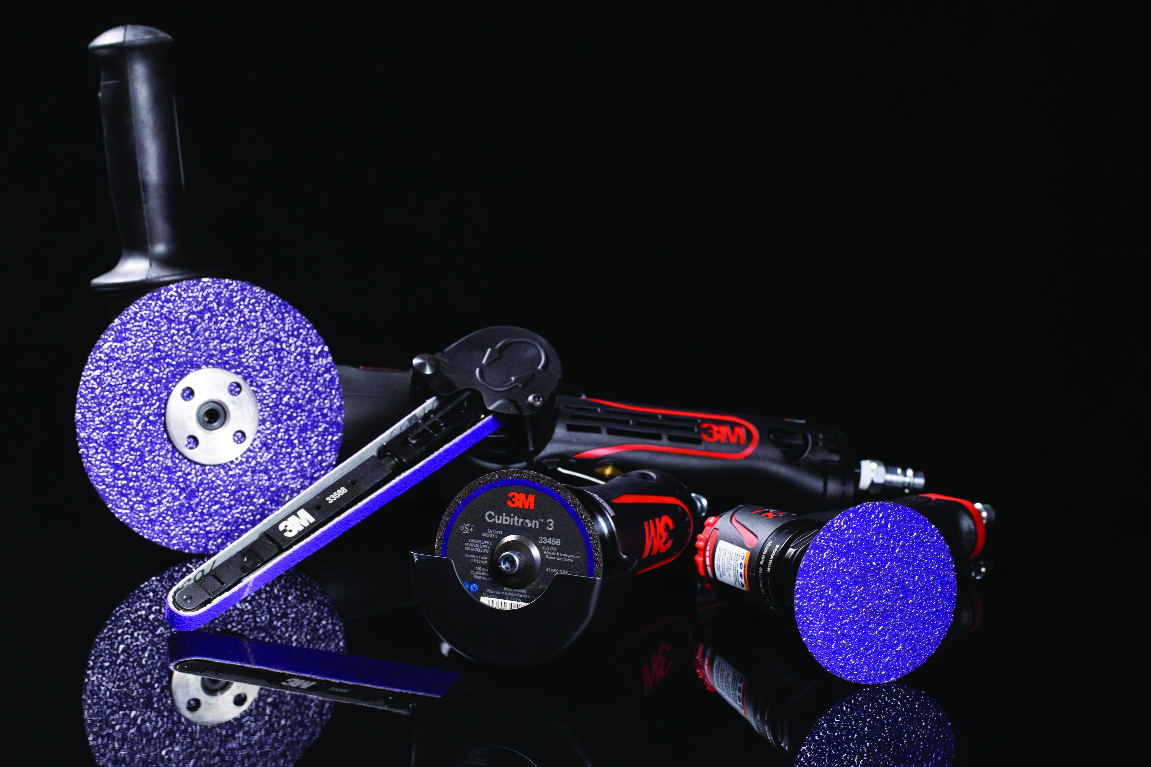 3M abrasive grinding and cutting tools collection including purple discs, angle grinder attachment, and cutting wheels on black background