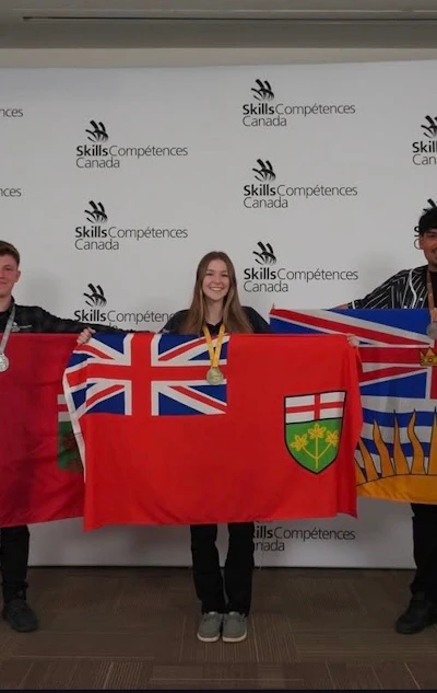 Three people holding Canadian provincial flags at Skills/Compétences Canada event