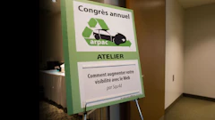 ARPAC annual congress atelier workshop sign about web visibility, displayed on green stand in indoor venue