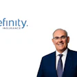 Professional headshot of male executive in dark suit and glasses with Definity Insurance branding