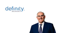 Professional headshot of male executive in dark suit and glasses with Definity Insurance branding