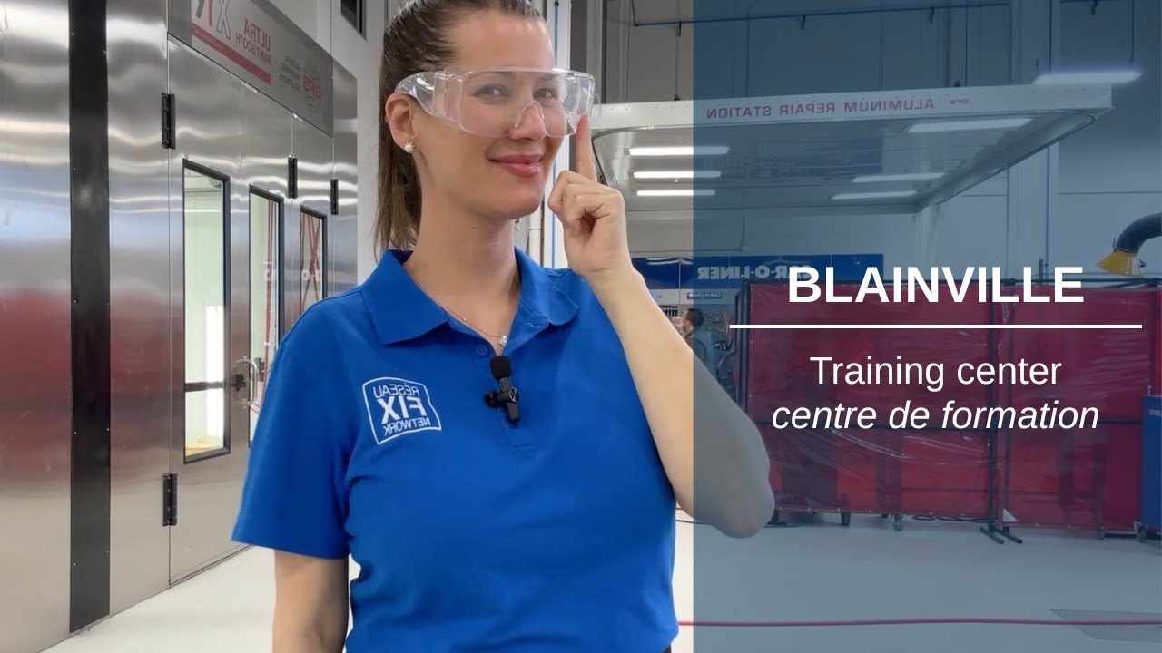 Woman in blue polo shirt at Blainville training center wearing safety glasses