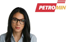 Professional woman wearing glasses and light blue striped shirt with Petromin company logo