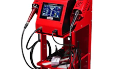 Red industrial welding machine with digital control panel, gas cylinder, and dual welding torches on wheeled cart
