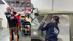 Volunteers restoring a vintage car at an indoor workshop event, with team members working on vehicle body panels and doors.