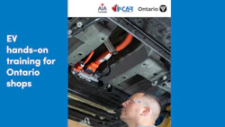 Technician examining electric vehicle battery system during hands-on EV training program in Ontario