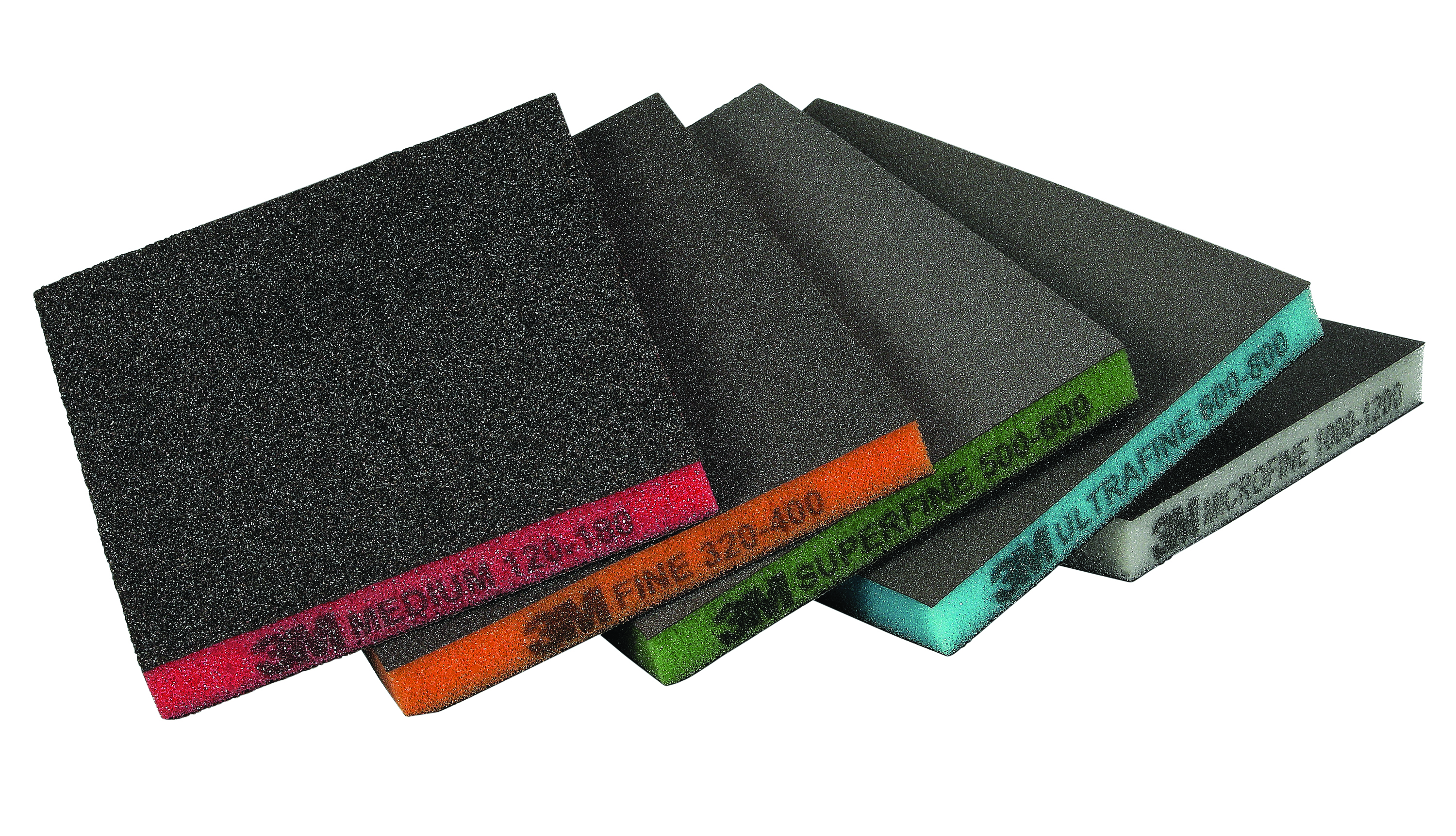 Assorted sandpaper sheets fanned in display showing different grit levels with colored edge labels