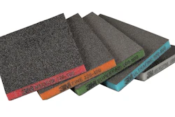 Assorted sandpaper sheets fanned in display showing different grit levels with colored edge labels