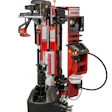 Red and black automatic tire changer machine with pneumatic arm and control panel for vehicle wheel service