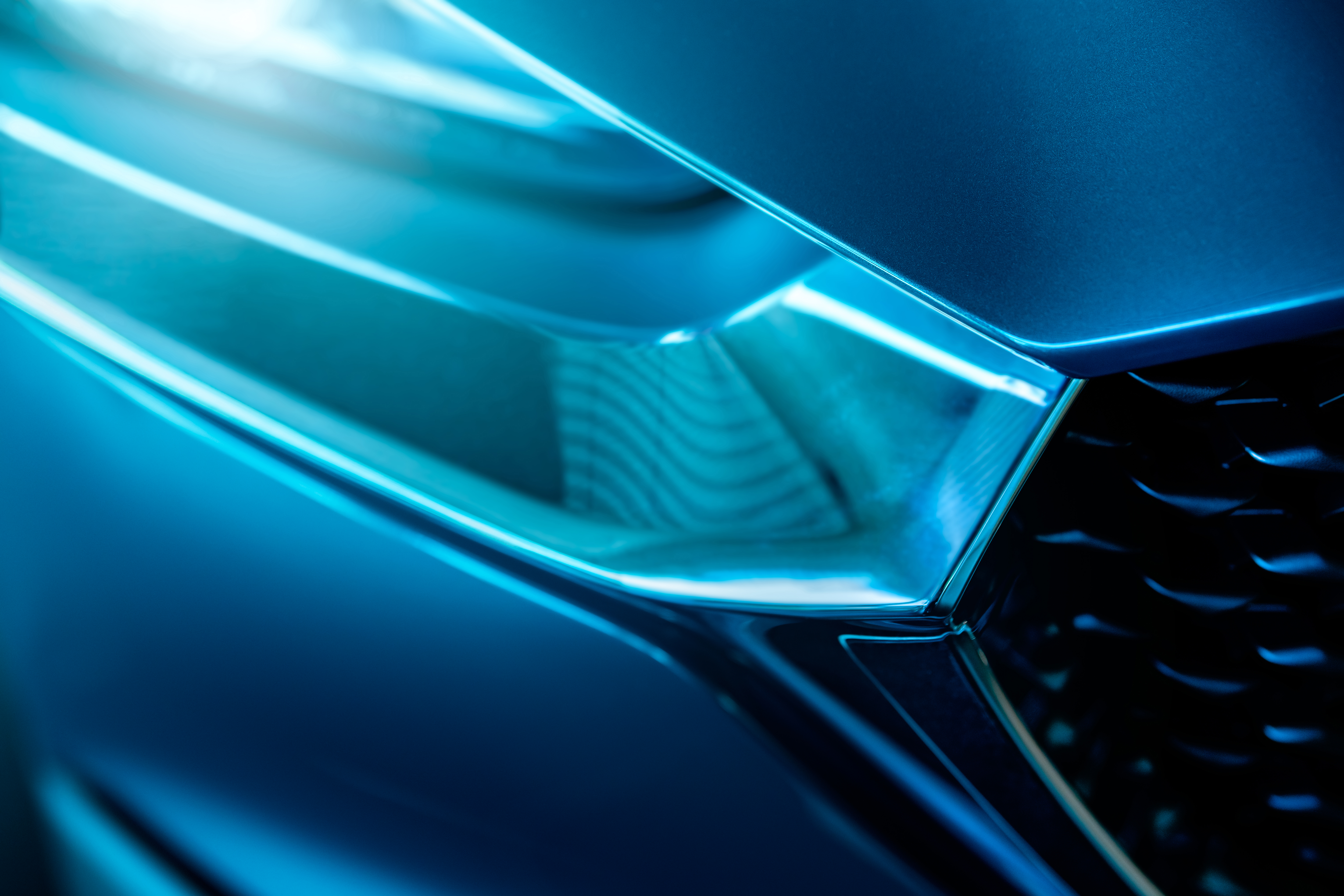 Abstract blue geometric shapes with glowing cyan edges and gradient lighting effects