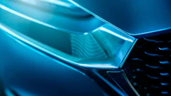 Abstract blue geometric shapes with glowing cyan edges and gradient lighting effects
