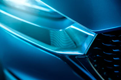 Abstract blue geometric shapes with glowing cyan edges and gradient lighting effects
