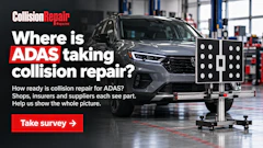 Collision repair shop promoting ADAS calibration survey with vehicle on alignment rack and testing equipment