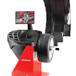 JBT B1200 wheel balancer with digital display monitor and mounted tire assembly