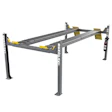 Bendpak four-post automotive lift with gray frame, yellow safety arms, and dual runway beams for vehicle service