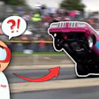 Cartoon character with surprised expression and question mark reacting to drag racing car performing wheelie at track