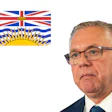 British Columbia flag alongside professional portrait of an older man in business attire wearing glasses