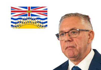 British Columbia flag alongside professional portrait of an older man in business attire wearing glasses