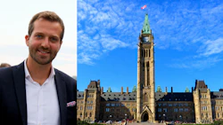 Professional man in business attire beside Parliament of Canada's Centre Block under blue sky