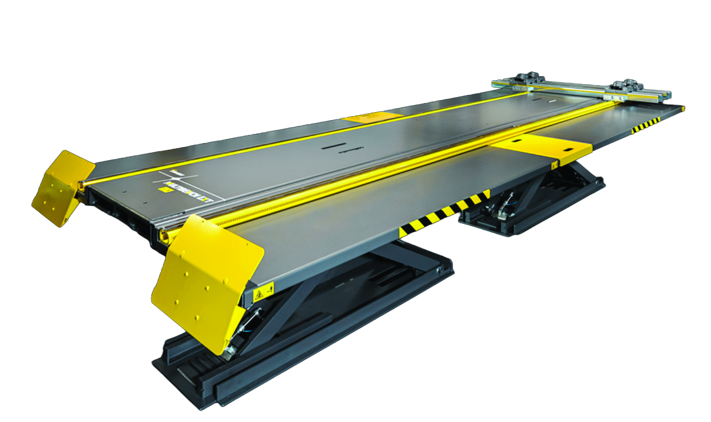 Yellow and black industrial car lift platform with gray deck and safety striping