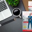 Collision Repair Magazine cover displayed on desk with laptop, coffee, and office supplies