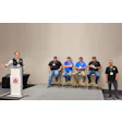 Panel discussion at ARC conference with speaker at podium and five seated panelists