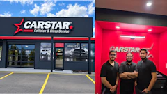 CARSTAR collision and glass service facility with storefront and three employees standing in front of red branded wall